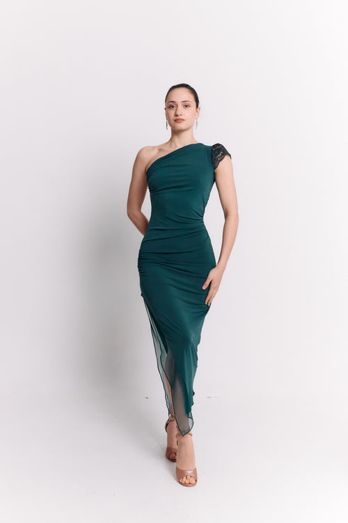 Woman wearing a green one-shoulder dress on a white background