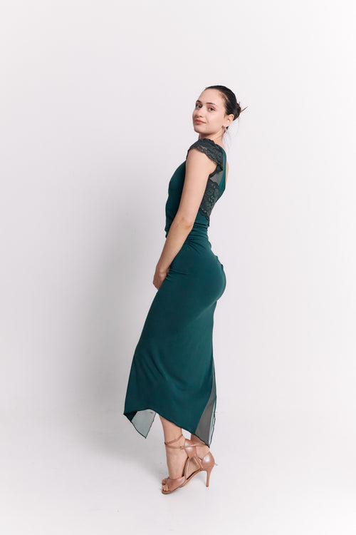 Woman wearing a green dress against a white background
