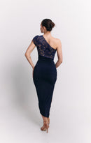 Woman wearing a navy one-shoulder dress on a white background
