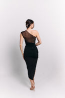 Woman wearing a black one-shoulder dress on a white background