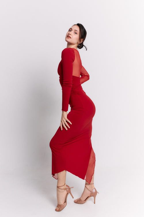 Woman wearing a red dress with cut-out sleeves on a white background